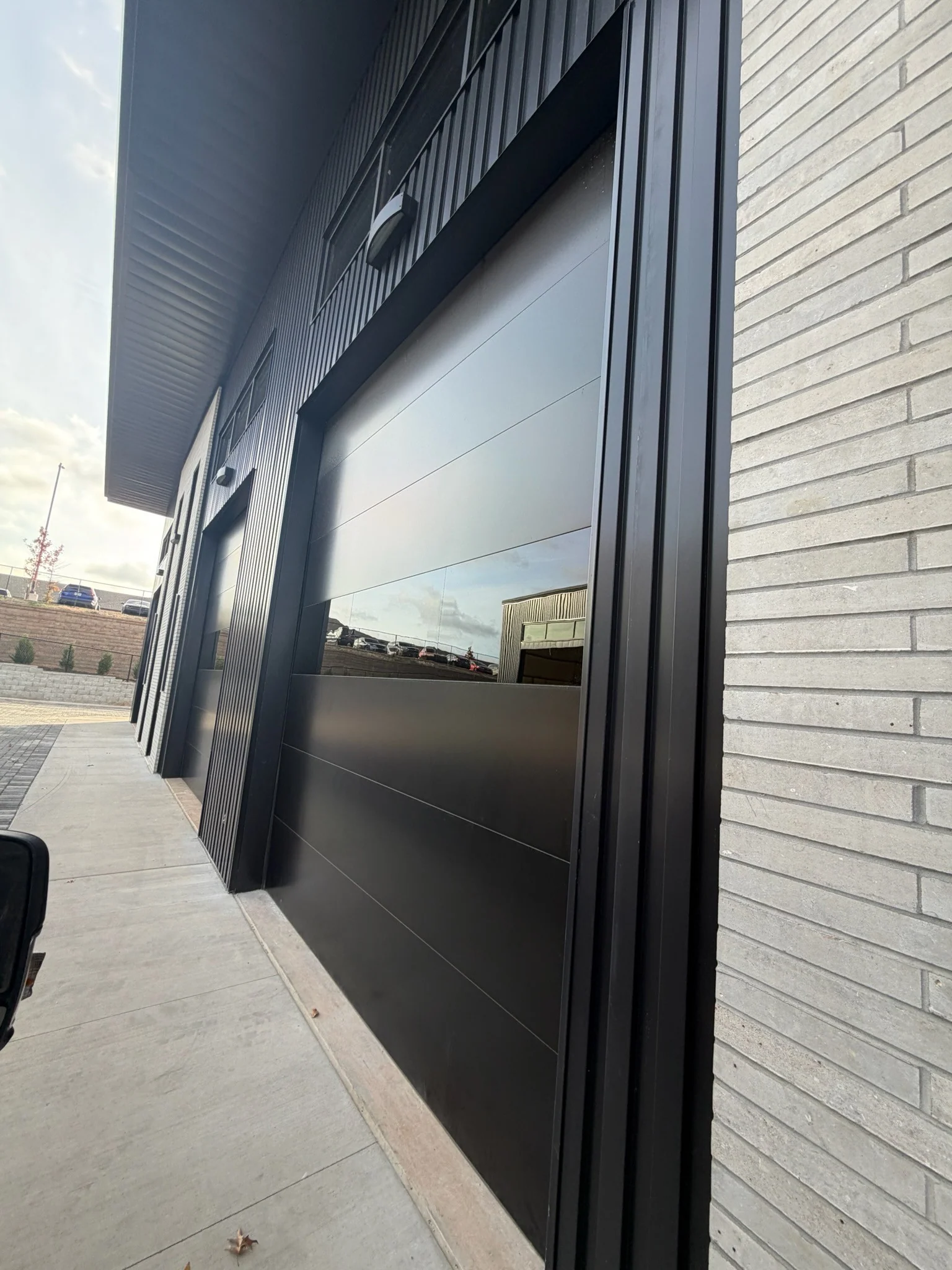 Infinity - Flush Panel Smooth Steel Garage Door with Horizontal Modern Glass Modern Design - Image 21