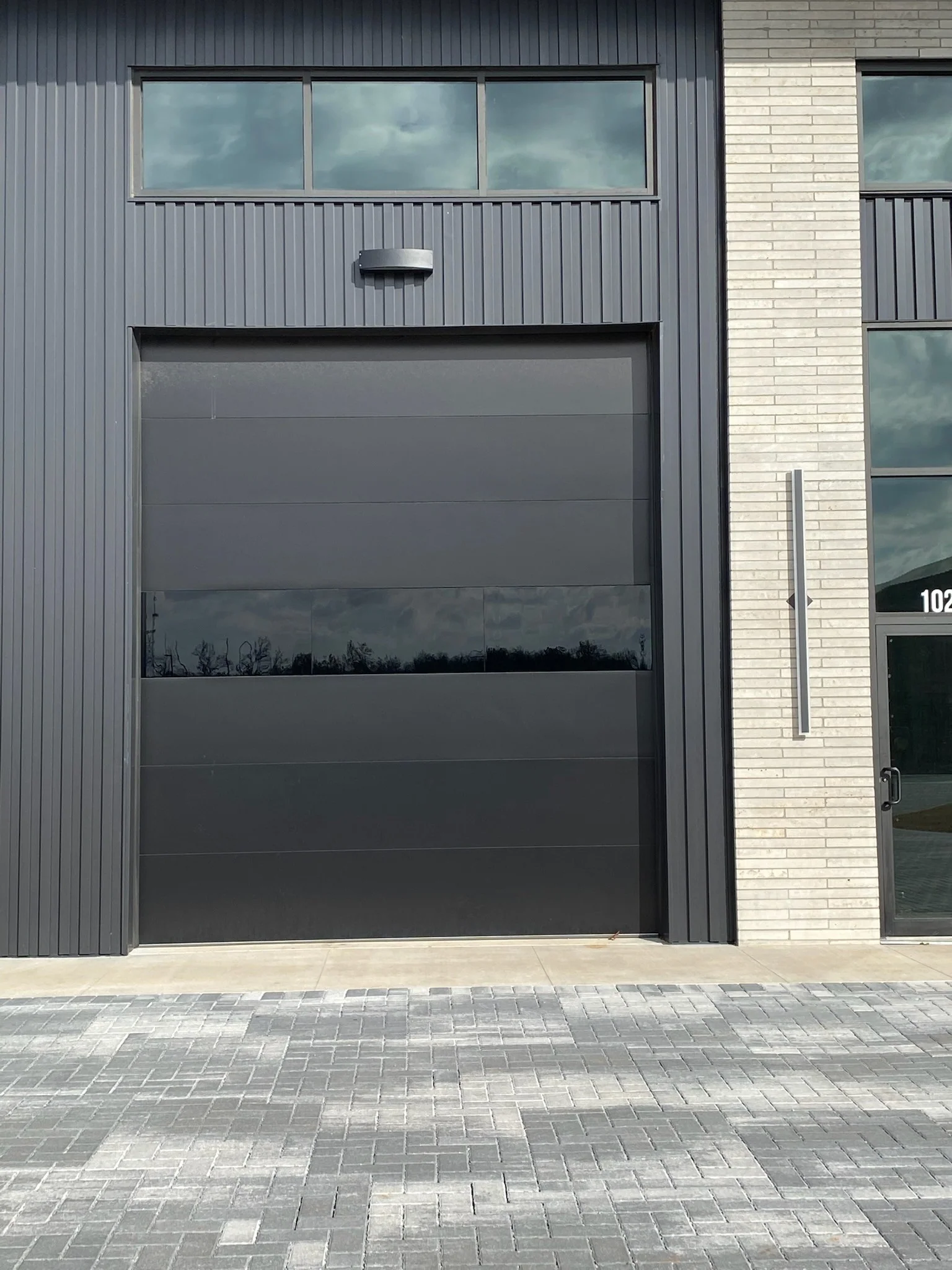 Infinity - Flush Panel Smooth Steel Garage Door with Horizontal Modern Glass Modern Design - Image 26