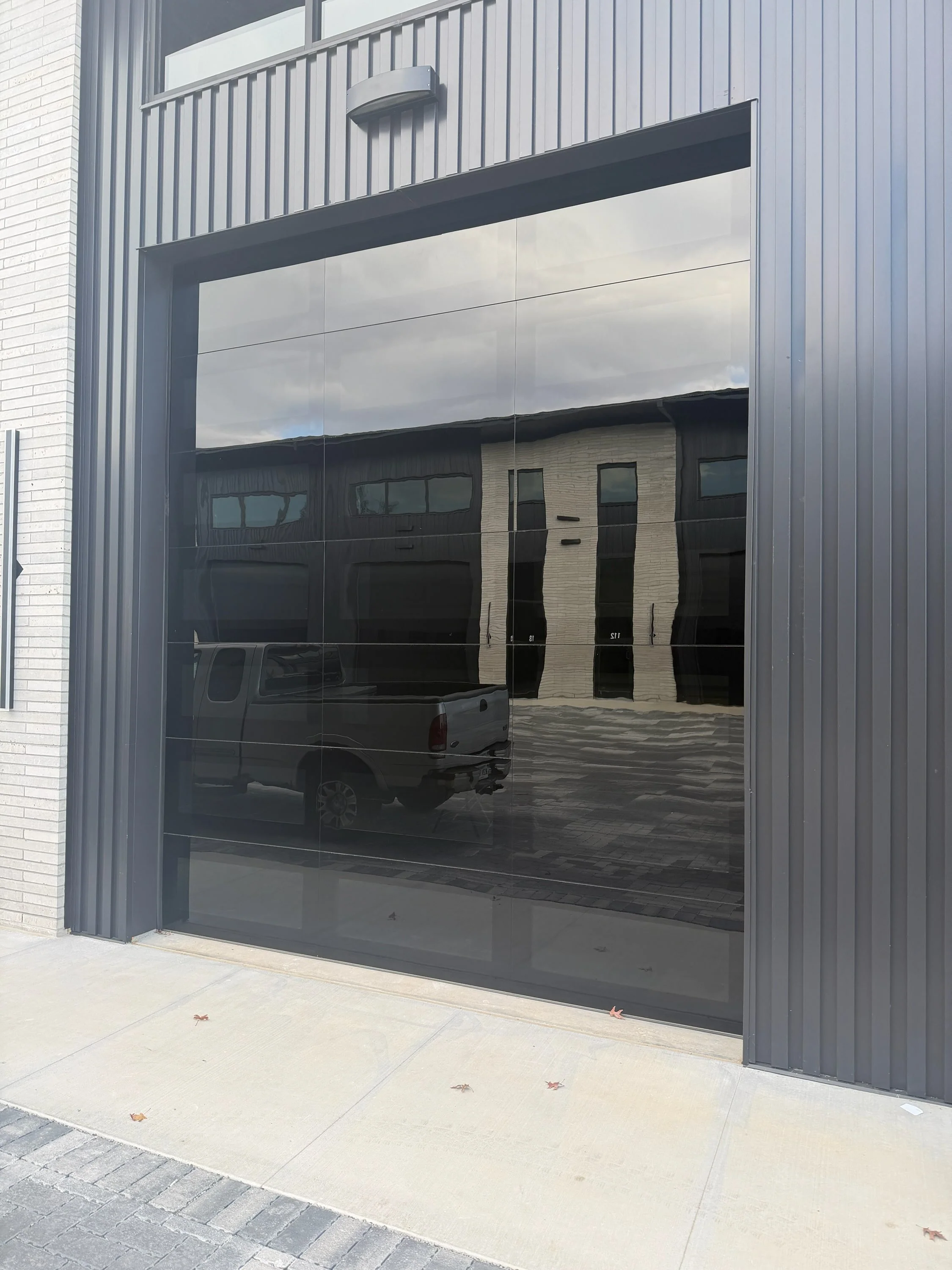 Infinity - Flush Panel Smooth Steel Garage Door with Horizontal Modern Glass Modern Design - Image 27