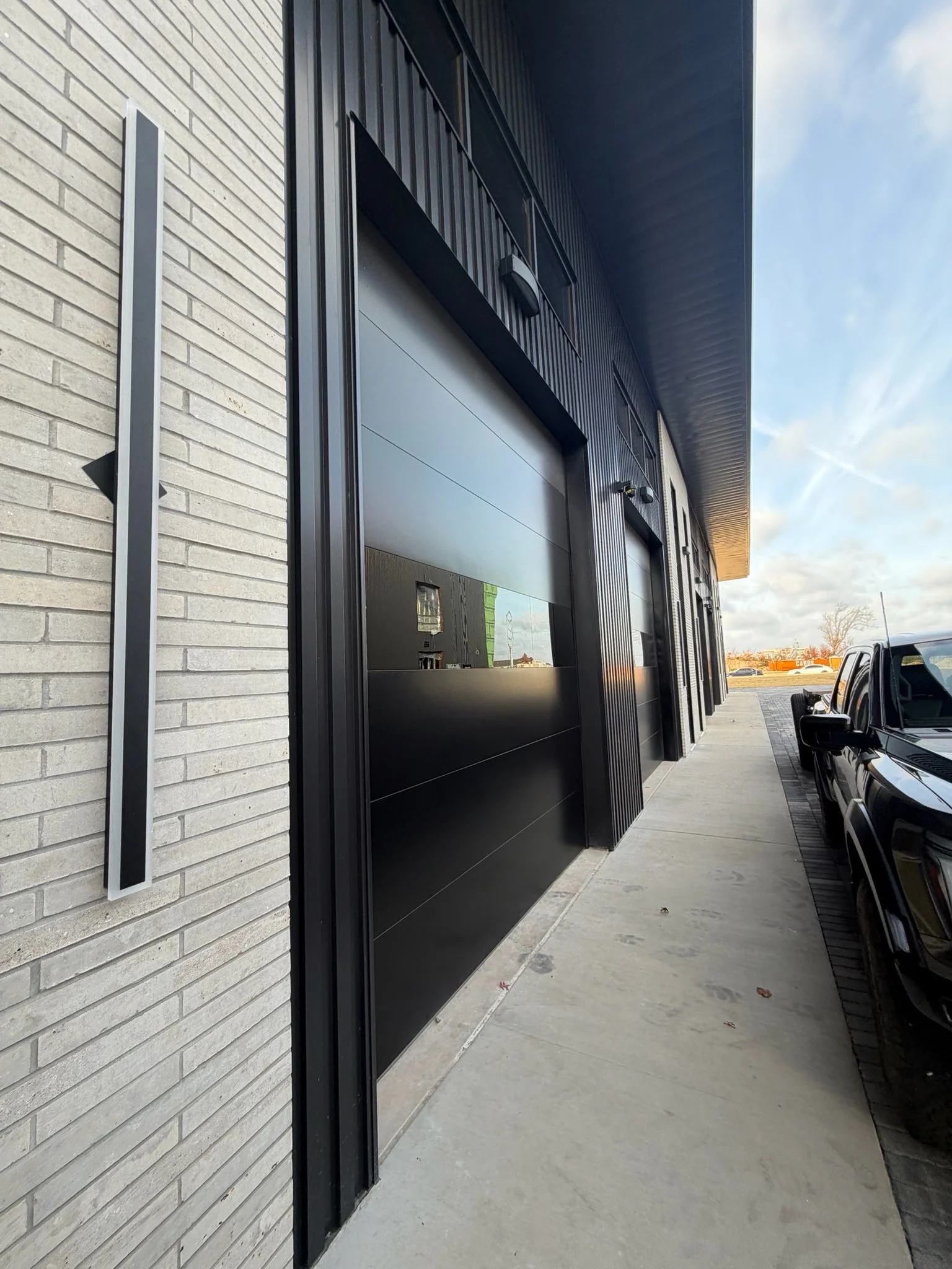 Infinity - Flush Panel Smooth Steel Garage Door with Horizontal Modern Glass Modern Design - Image 28